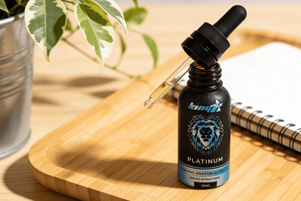 King K Platinum liquid kratom extract bottle shown in a lifestyle setting.