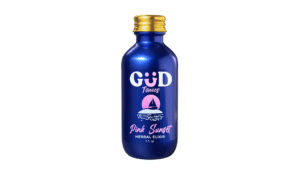 Blue 2oz Kava Tonics Pink Sunset Herbal Elixir bottle with gold cap, pink and white sunset sailboat design, cherry-strawberry-lemon flavor blend.